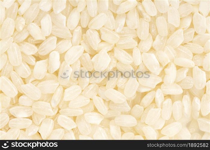 Uncooked rice background texture. Full frame