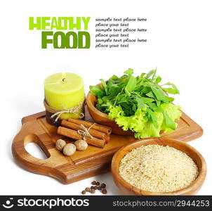 uncooked rice in wooden plate isolated on white background
