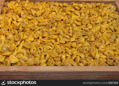 Uncooked Tortellini Italian Pasta in Wooden Compartmented Box