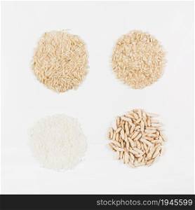 uncooked white brown puffed rice isolated white backdrop. High resolution photo. uncooked white brown puffed rice isolated white backdrop. High quality photo