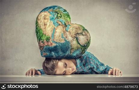 Under pressure of problem. Young woman pressed with globe to table. Elements of this image are furnished by NASA