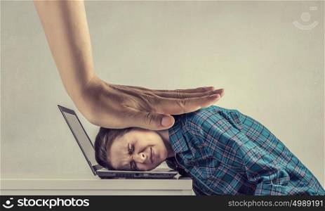 Under pressure of work. Woman programmer pressed with hand to laptop