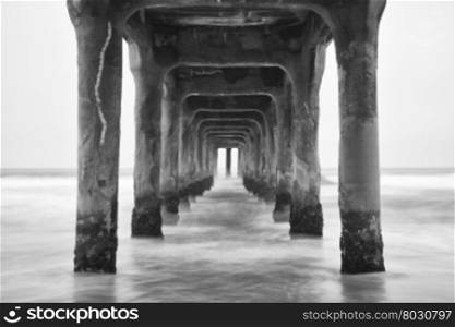 Under the Pier. Black and white photo Manhattan Beach, California