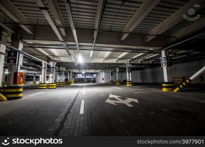 Underground illuminated parking with no people and stripped elements