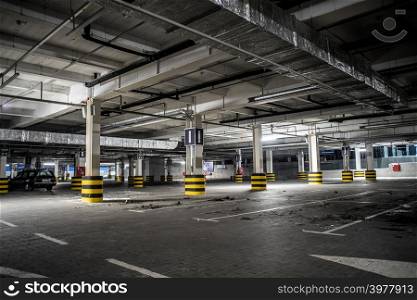 Underground illuminated parking with no people and stripped elements