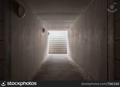 Underground passage with stairs in the glowing end darkness. Underground passage with stairs in the glowing end