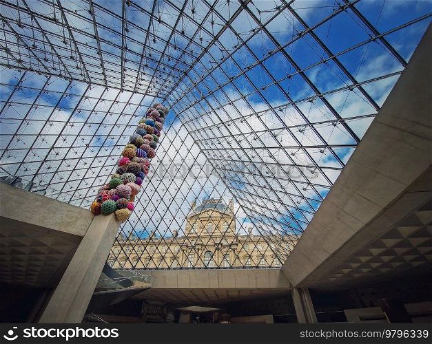 Underneath the Louvre glass pyramid. Beautiful architectural details with an abstract mixture of classical and modern architecture styles
