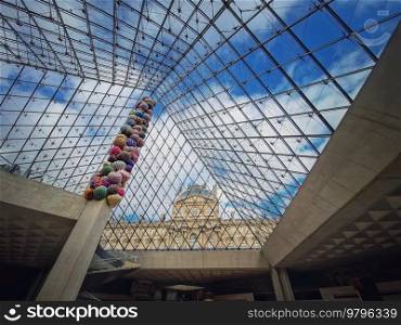 Underneath the Louvre glass pyramid. Beautiful architectural details with an abstract mixture of classical and modern architecture styles