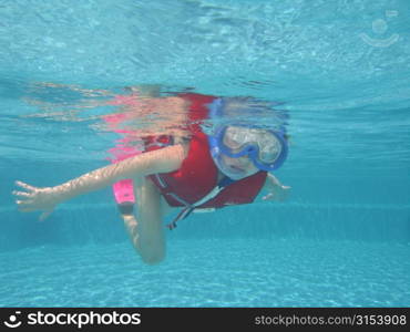 Underwater view of a young woman wearing scuba gear, Moorea, Tahiti, French Polynesia, South Pacific