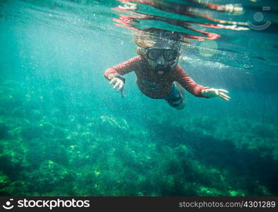 Underwater view of boy snorkeling, Menorca, Balearic islands, Spain