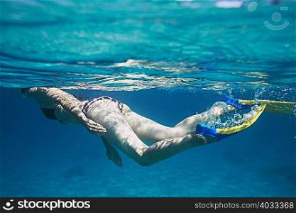 Underwater view of female snorkeler, Bali, Indonesia