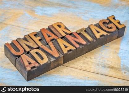 unfair advantage - word abstract n vintage letterpress wood type blocks stained by color inks