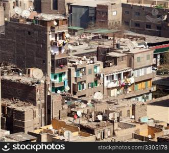 Unfinished buildings in downtown Cairo with trash on all roofs