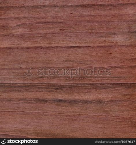 Unfinished solid Brazilian cherry wood texture background in filled frame format