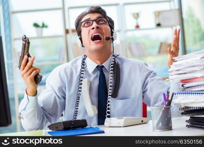 Unhappy angry call center worker frustrated with workload. The unhappy angry call center worker frustrated with workload