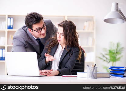 Unhappy boss having a chat with his secretary