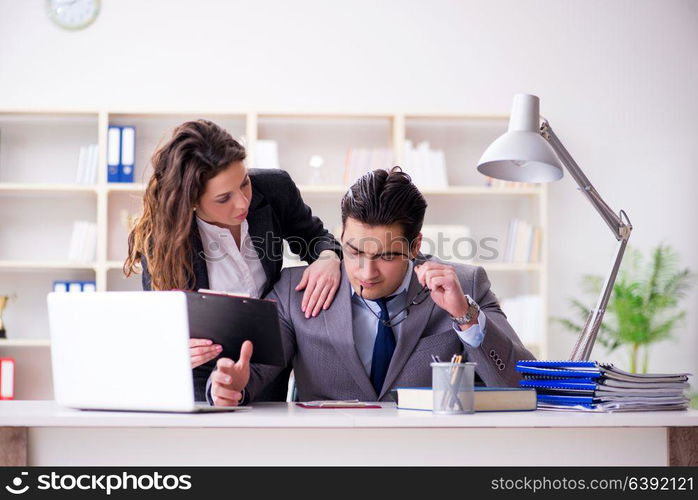 Unhappy boss having a chat with his secretary