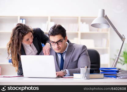 Unhappy boss having a chat with his secretary