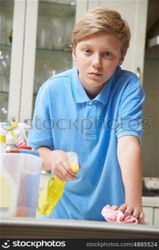 Unhappy Boy Helping to Clean House