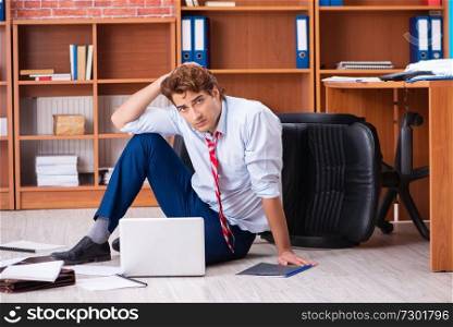 Unhappy businessman sitting in the office 