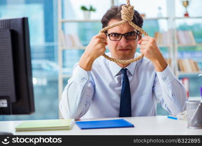 Unhappy businessman thinking of hanging himself in the office