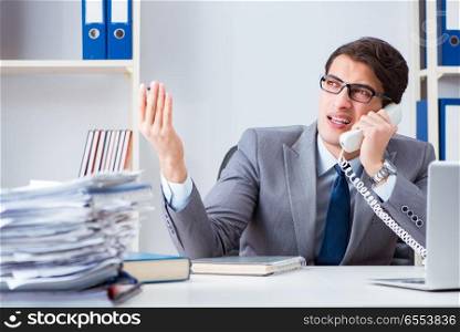 Unhappy businessman working in office