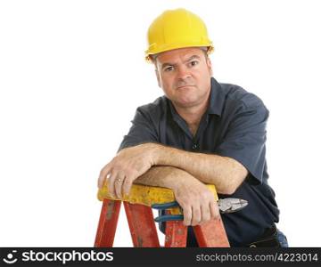 Unhappy, dissatisfied construction worker on a ladder. Isolated on white.