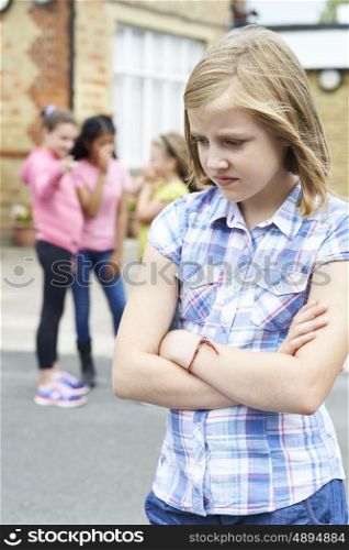 Unhappy Girl Being Gossiped About By School Friends