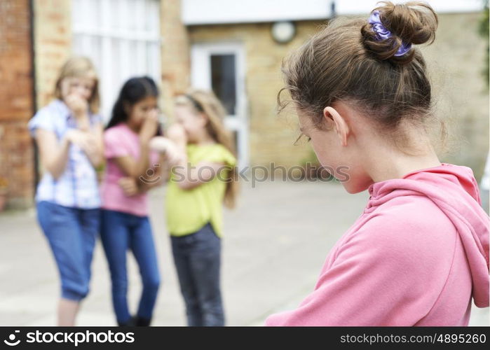 Unhappy Girl Being Gossiped About By School Friends