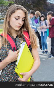 Unhappy Girl Being Gossiped About By School Friends