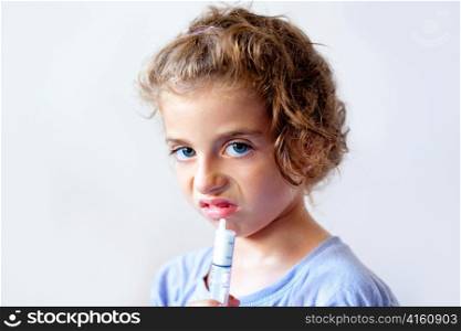 Unhappy kid girl with syringe medicine dose funny expression