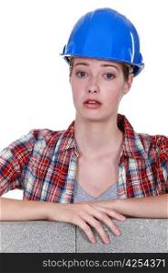 Unhappy looking female builder