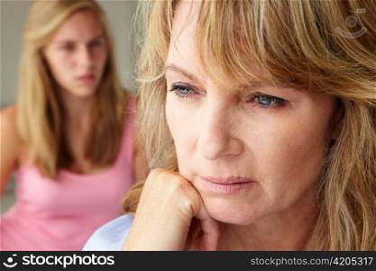 Unhappy mother with teenage girl