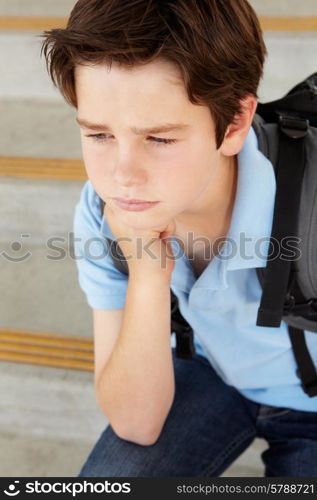 Unhappy Pre teen boy at school