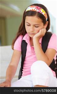 Unhappy Pre teen girl at school