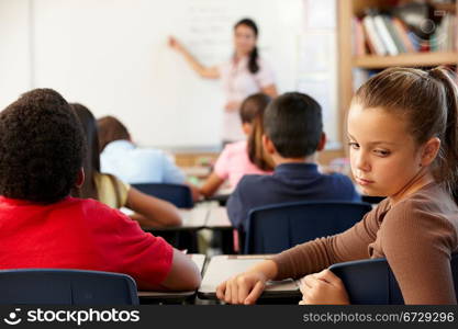 Unhappy schoolgirl in class