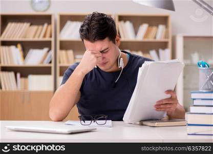Unhappy student with too much to study