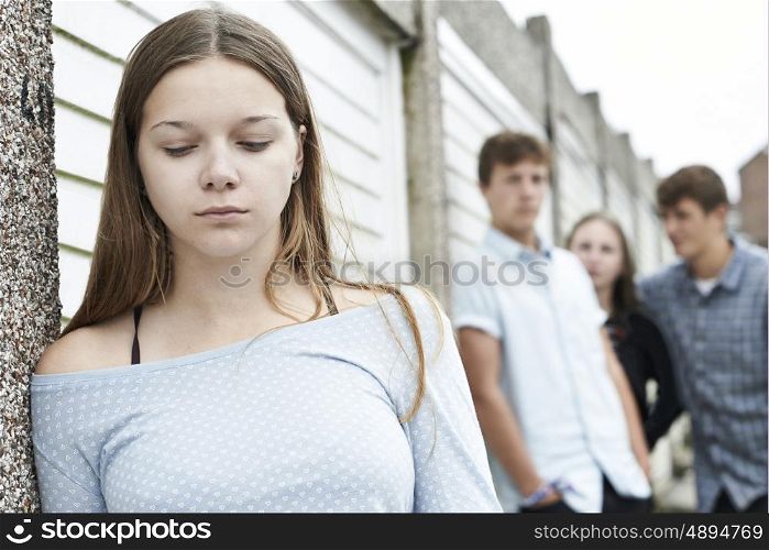 Unhappy Teenage Girl Being Talked About By Peers