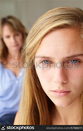 Unhappy teenage girl with mother