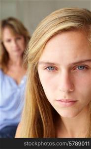 Unhappy teenage girl with mother