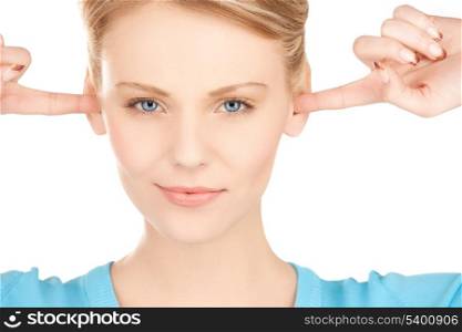 unhappy woman closing her ears with fingers