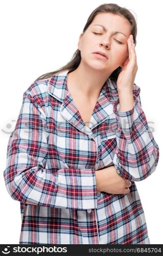Unhappy woman in pajamas with a severe headache, on a white back. Unhappy woman in pajamas with a severe headache, on a white background