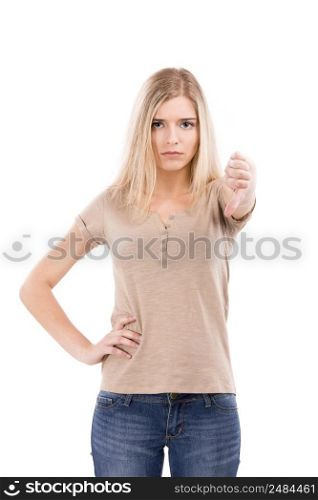 Unhappy woman looking to the camera with thumbs down, isolated over white background