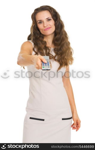 Unhappy young woman switching channels with tv remote control
