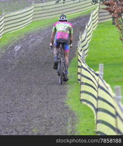 Unidentified cyclist compete in cycle race of cyclocross