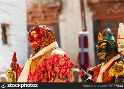 Unidentified monks in masks perform a religious masked and costumed mystery dance of Tibetan Buddhism during the Cham Dance Festival in Lamayuru monastery, India.