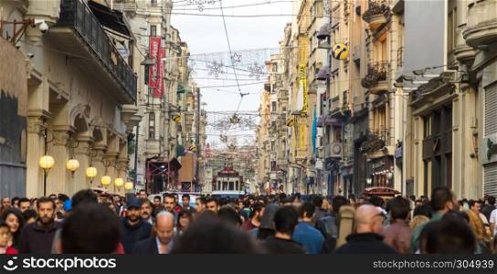 Unidentified people walk and explore at Istiklal street,a popular street at Beyoglu district in Istanbul,Turkey.06 October 2014. Unidentified people walk and explore at Istiklal street