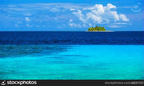 Uninhabited island in the sea, transparent blue water, virgin wild nature, scenes destination, sunny day, exotic travel and tourism concept