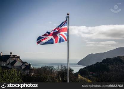 Union jack flag blowing in the wind on the English coast