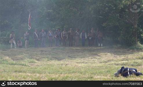 Union soldiers firing across battlefield